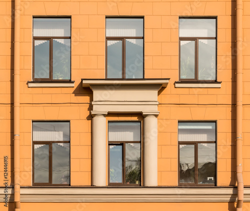 Several windows in a row on facade of Secondary school №243, St. Petersburg, Russia.