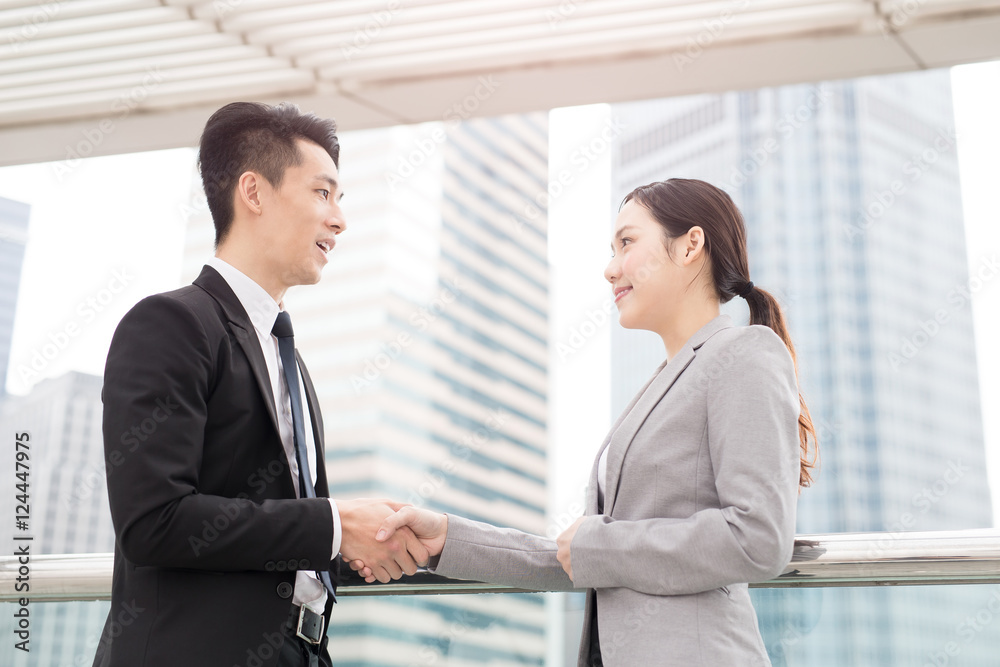businesswoman shaking hands with businessman businesswoman shaking hands with businessman