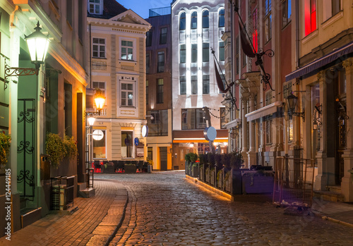 Night view of a street in Riga that is the capital and largest city of Latvia, a major commercial, cultural, historical and tourist center of the Baltic region 