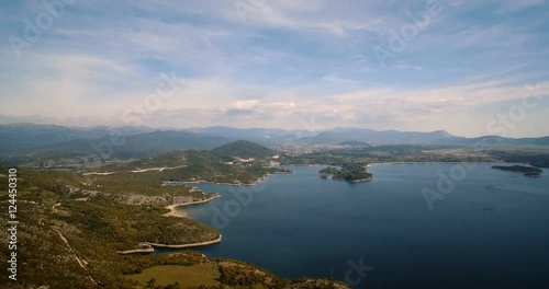 Aerial, Flying Around Jezero Krupac  Lake, Montenegro - Graded and stabilized version. Watch also for the native material, straight out of the camera. photo
