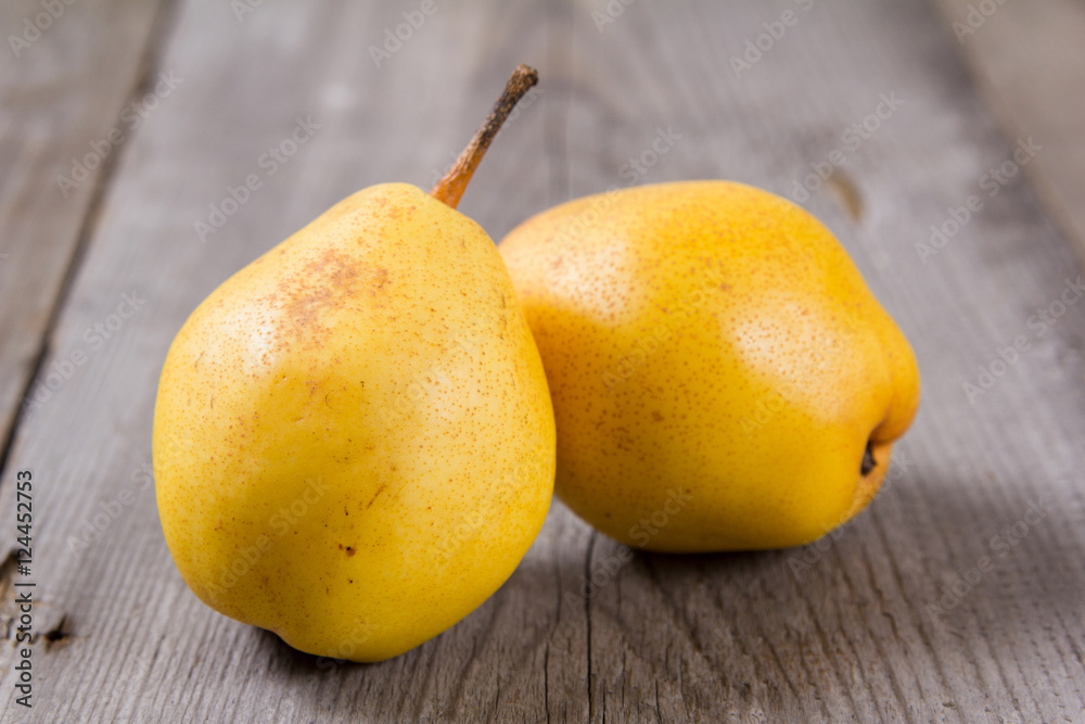 Fresh ripe organic yello pears on rustic wooden table, natural background, diet food. Fresh ripe organic yello pears on rustic wooden table, natural background, diet food.