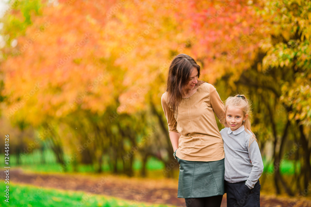 Family in fall. Mother and kid enjoy warm autumn Family in fall. Mother and kid enjoy warm autumn