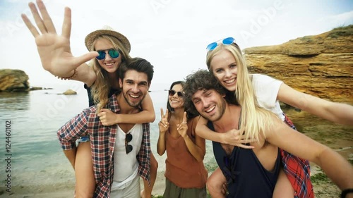 Shot of a group of young friends enjoying a day at the beach