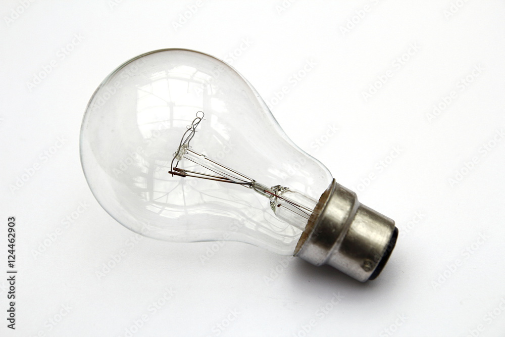 Incandescent tungsten clear light bulb isolated on white