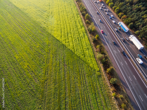 Green cultivated fields by highway in Netherlands