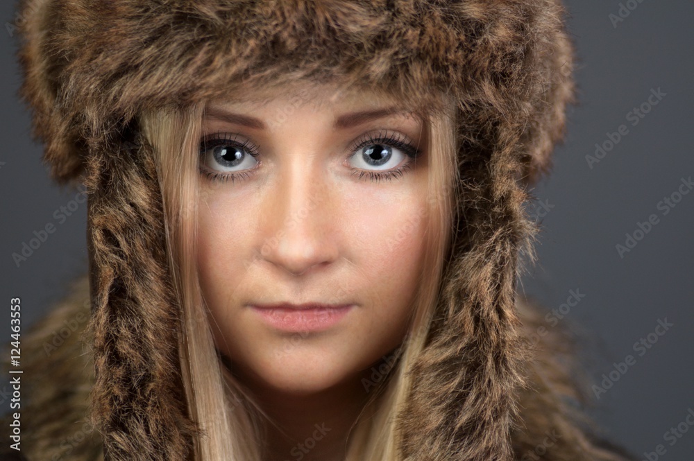 Young, attractive woman in a fur cap. Clothing for the winter. Young, attractive woman in a fur cap. Clothing for the winter.