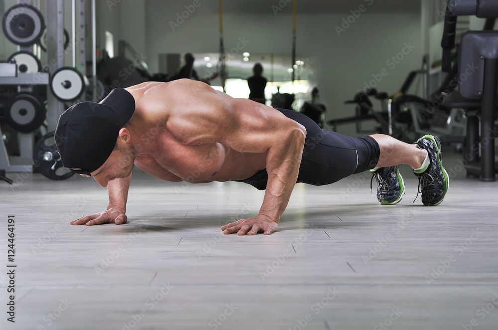 Bodybuilder Doing Extreme Push Ups On Floor-96768