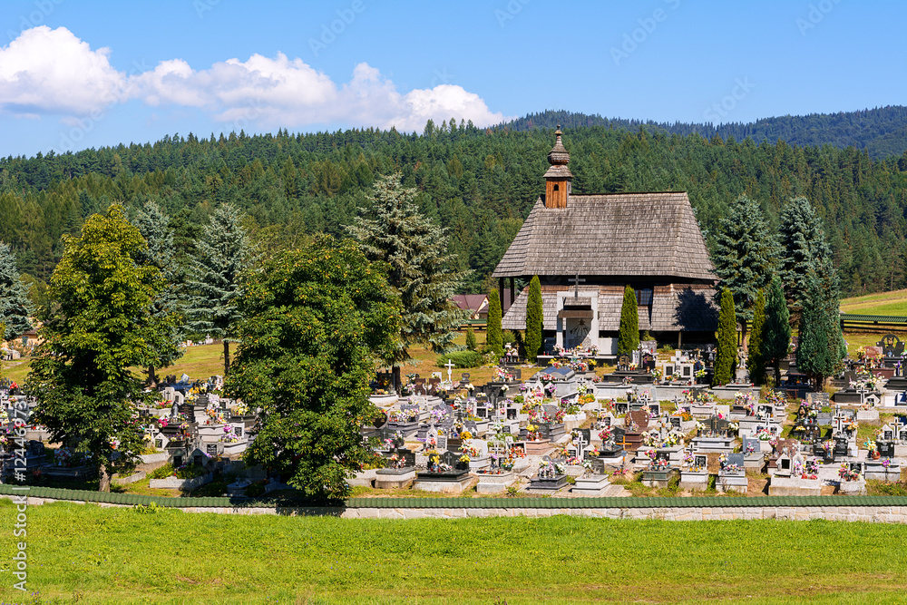 The Cemetery Chapel of St. Sebastian in Maniowy village. Interesting historic wooden building forming the Wooden Architecture Route in Malopolska. Poland. The Cemetery Chapel of St. Sebastian in Maniowy village. Interesting historic wooden building forming the Wooden Architecture Route in Malopolska. Poland.