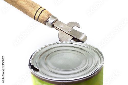 Bild auf Leinwand Ancient can opener opening a can