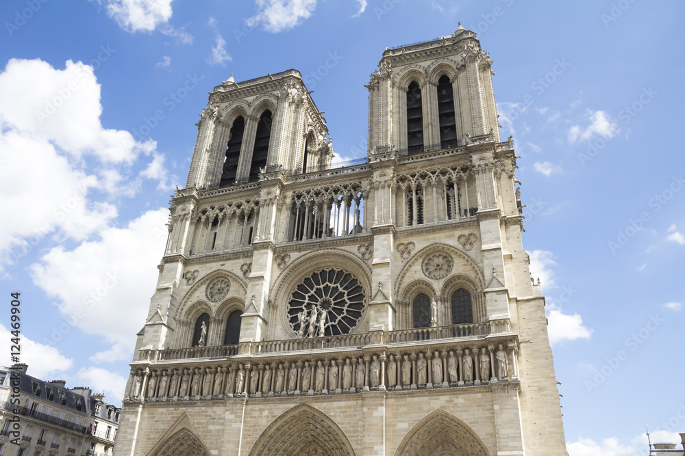 Paris, France - famous Notre Dame cathedral facade saint statues. UNESCO World Heritage Site.