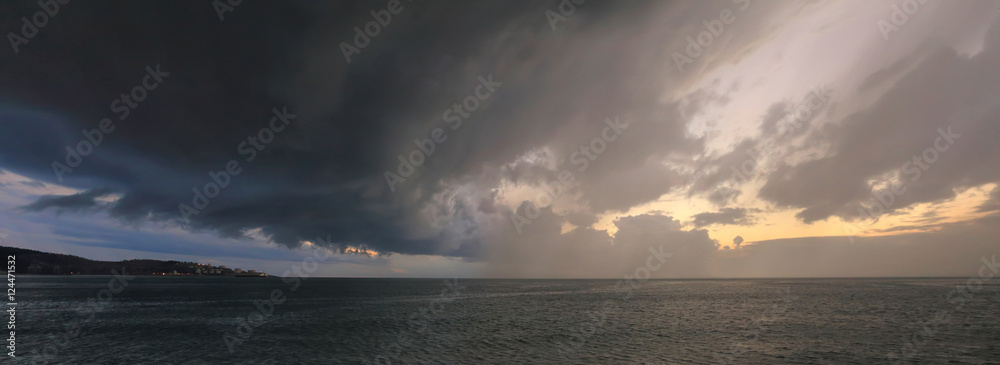 Heavy storm with dark clouds abow sea