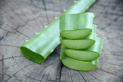 Slice aloe, Aloe Vera, Aloin, Barbados, Jafferabad, Star Cactus on the wooden floor photo