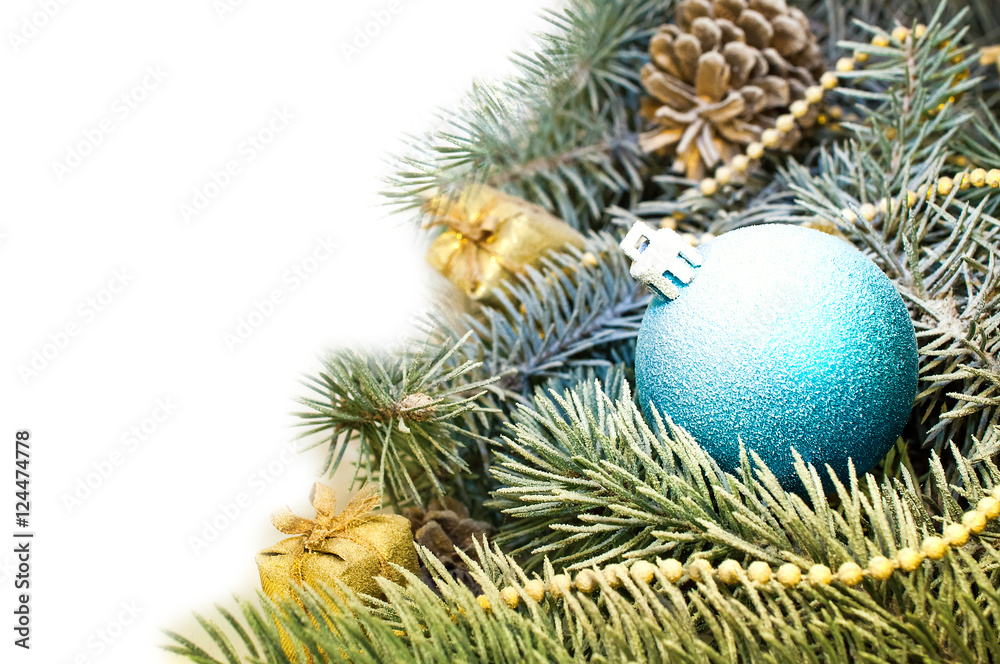 Christmas tree branches with cones, gifts and toys on a white ba Christmas tree branches with cones, gifts and toys on a white ba