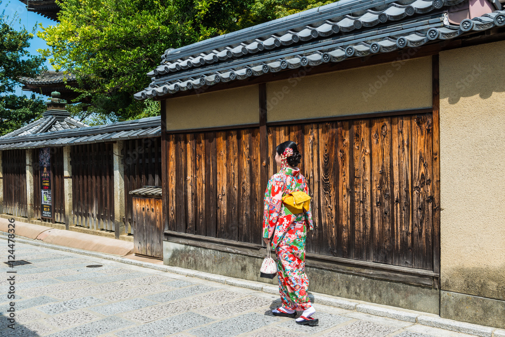 Fototapeta premium asian woman wearing kimono walking on the old street, Kyoto Japan