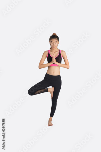 Young woman in yoga pose.