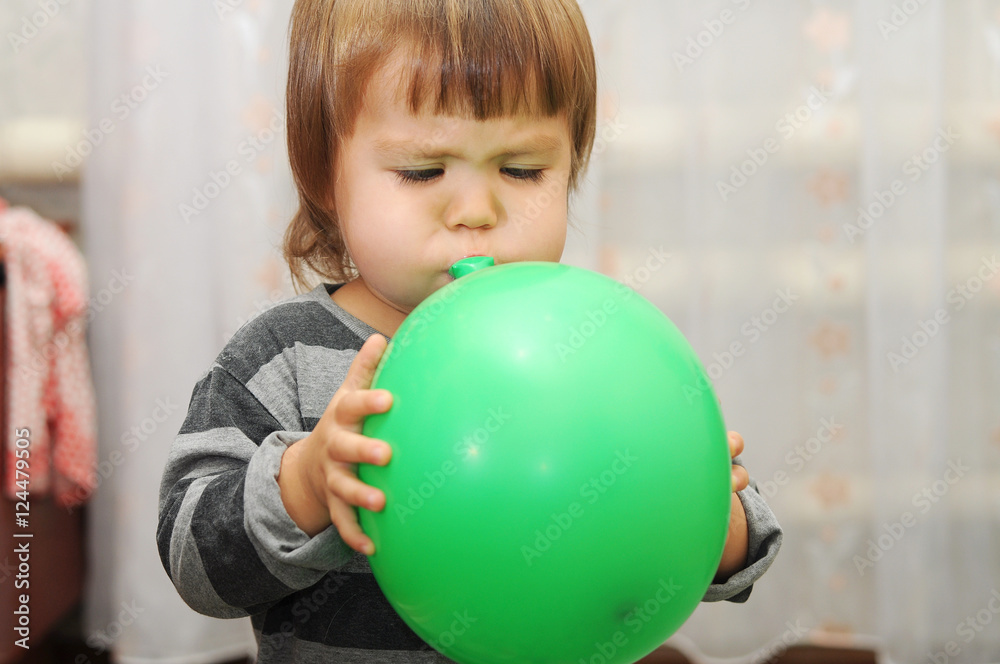 Little cute child blow a ball Little cute child blow a ball