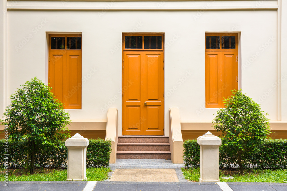 orange Door , orange window on Cream Wall on orange staircase wi orange Door , orange window on Cream Wall on orange staircase wi
