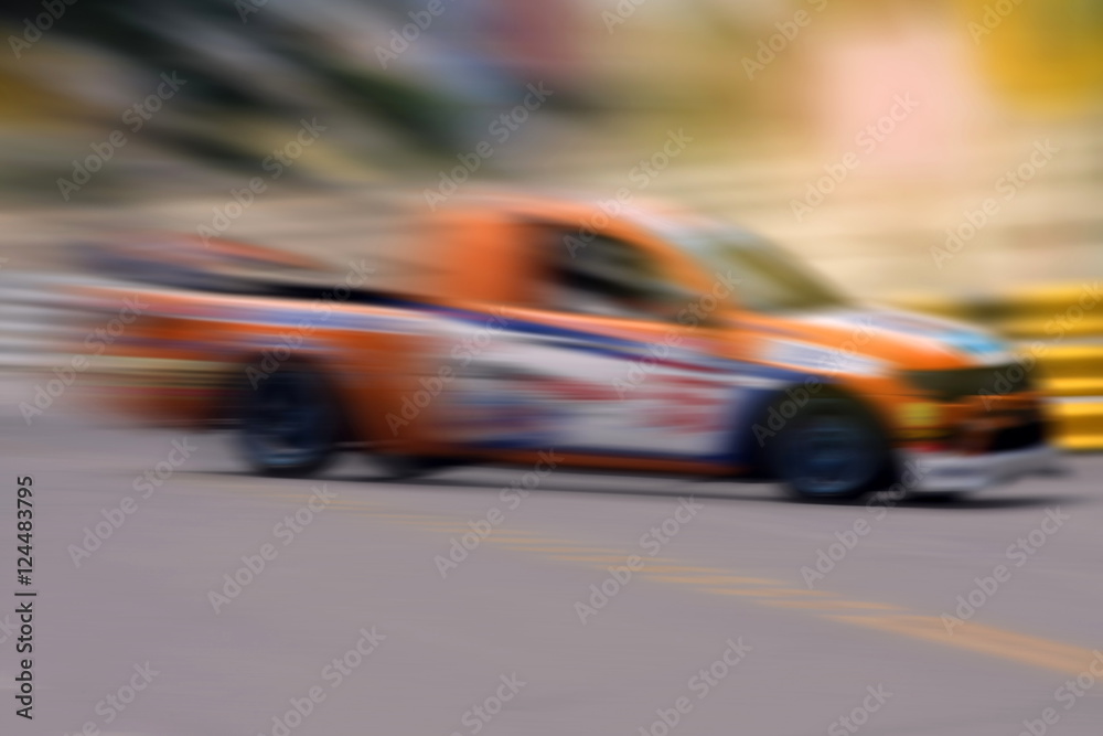 Race car racing on speed track with motion blur Race car racing on speed track with motion blur