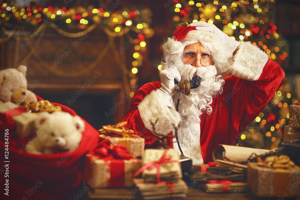 sad upset santa claus talking on phone sad upset santa claus talking on phone