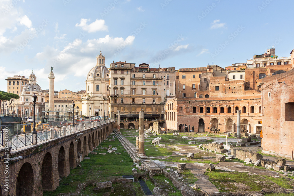 Roman forum ancient ruins in Rome with view on Trajan column, Italy