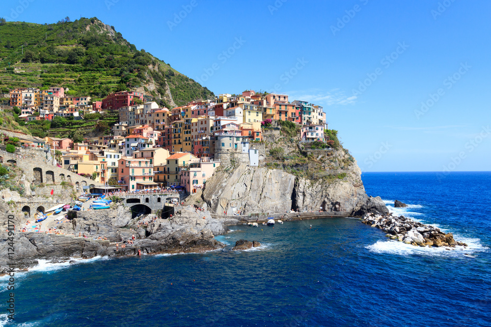 Cinque Terre village Manarola with colorful houses and Mediterranean Sea, Italy