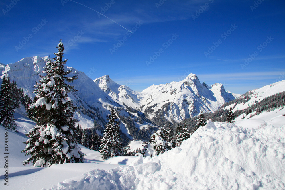 Blue sky over snowy white mountains