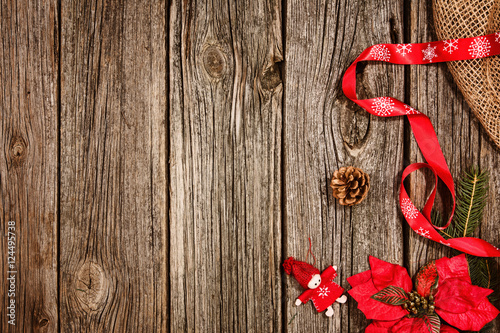Christmas decoration background over wooden table and linen cloth.