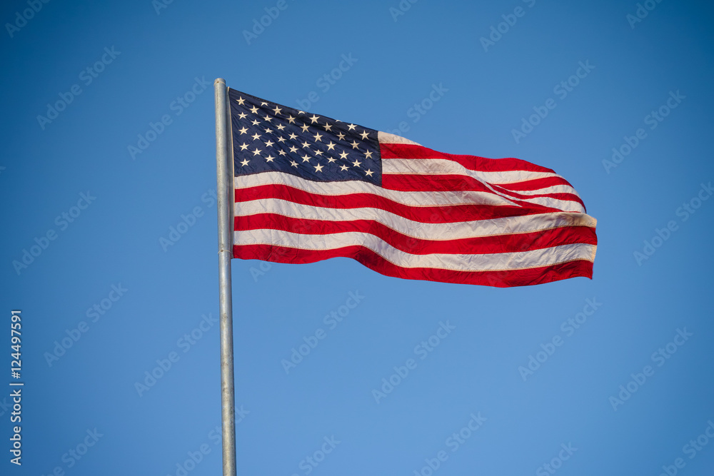 American flag against blue sky