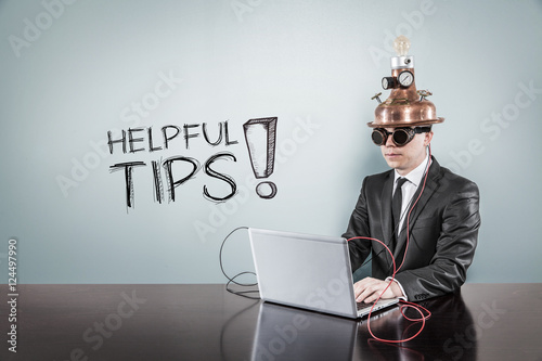Helpful tips text with vintage businessman using laptop photo