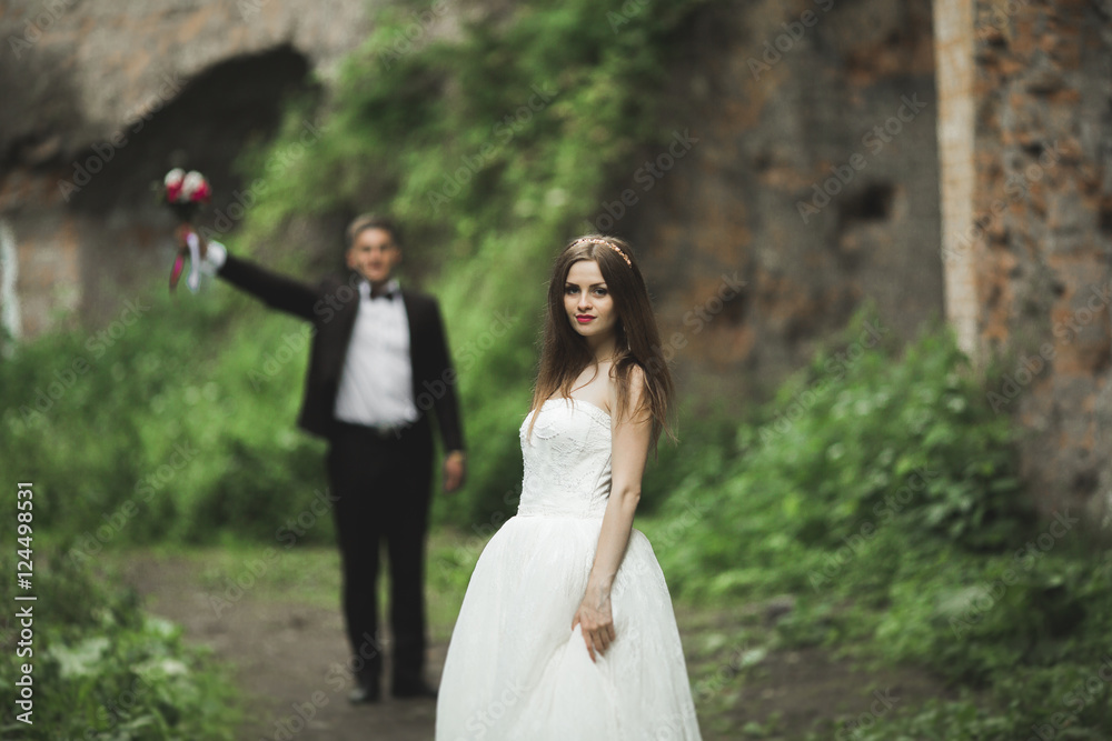 Beautiful bride posing near rocks with  views