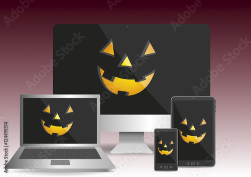 computer laptop tablet smartphone with halloween scary pumpkin f