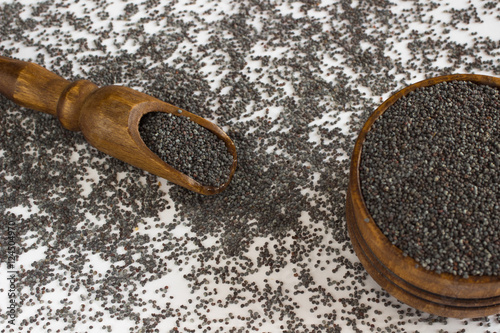 Bag with poppy seeds and scoop photo