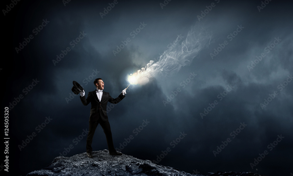 Businessman demonstrating magic . Mixed media Businessman demonstrating magic . Mixed media