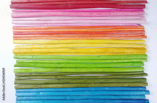 Colorful wooden sticks on white background