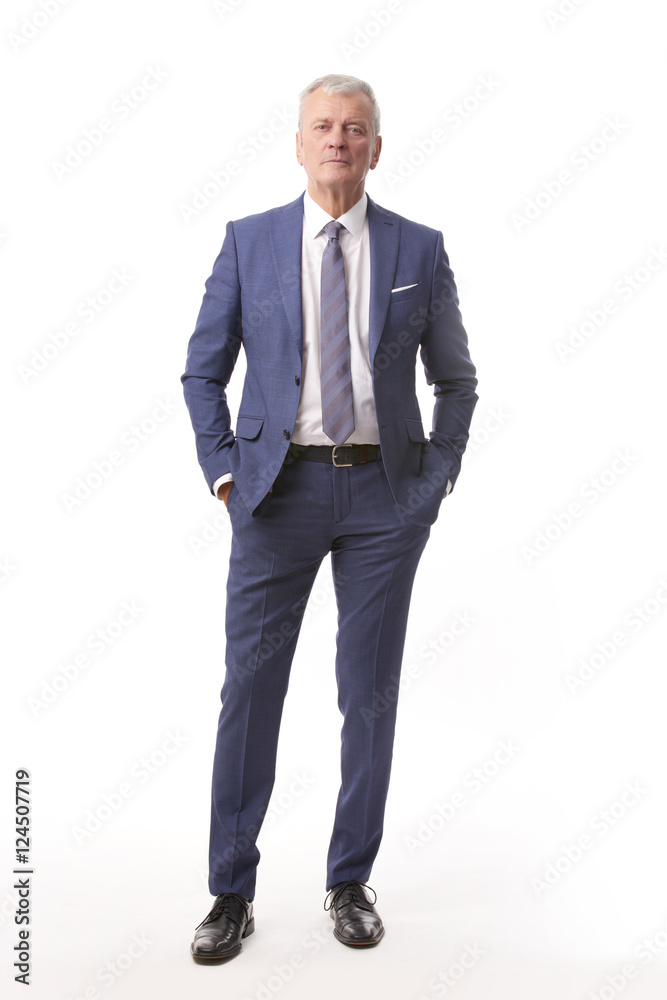 Old businessman portrait.Full length shot of a senior manager standing in suit at isolated white background. Old businessman portrait.Full length shot of a senior manager standing in suit at isolated white background.