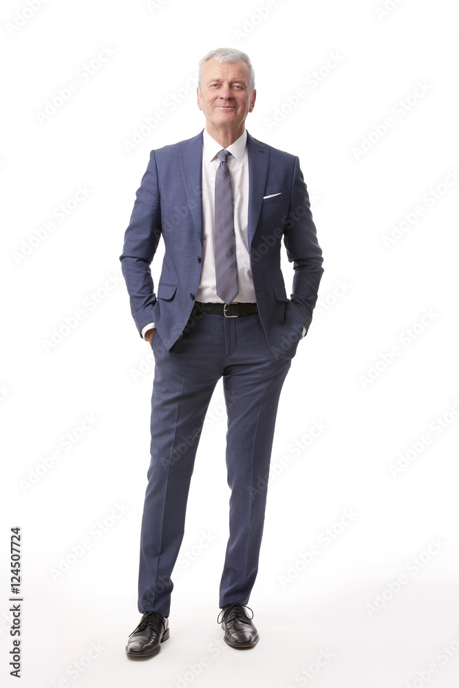 Old businessman portrait.Full length shot of a senior manager standing in suit at isolated white background. Old businessman portrait.Full length shot of a senior manager standing in suit at isolated white background.