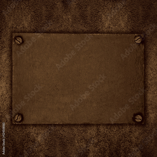 brown steel plate with screws