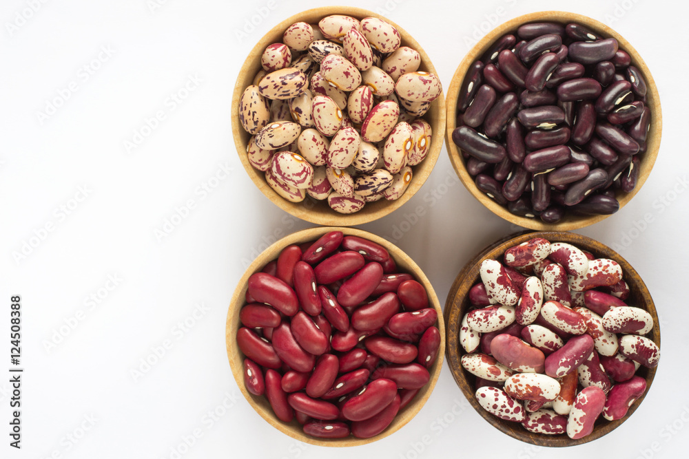 Four kinds of beans on white background. Top view.