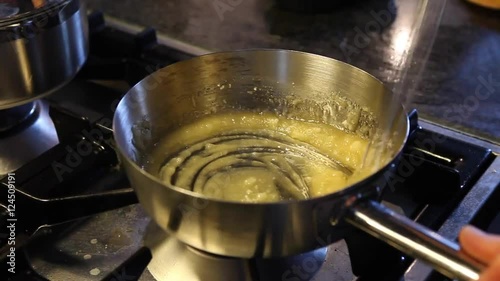 Making caramel on the stove photo