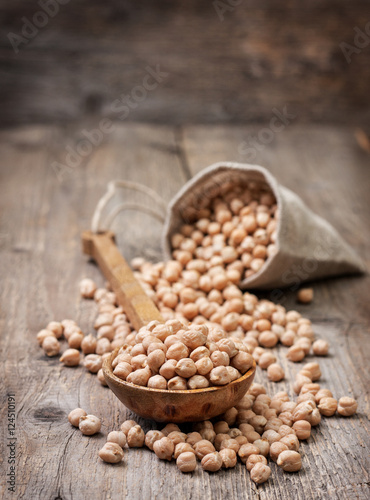 dried chickpeas in a wooden spoon