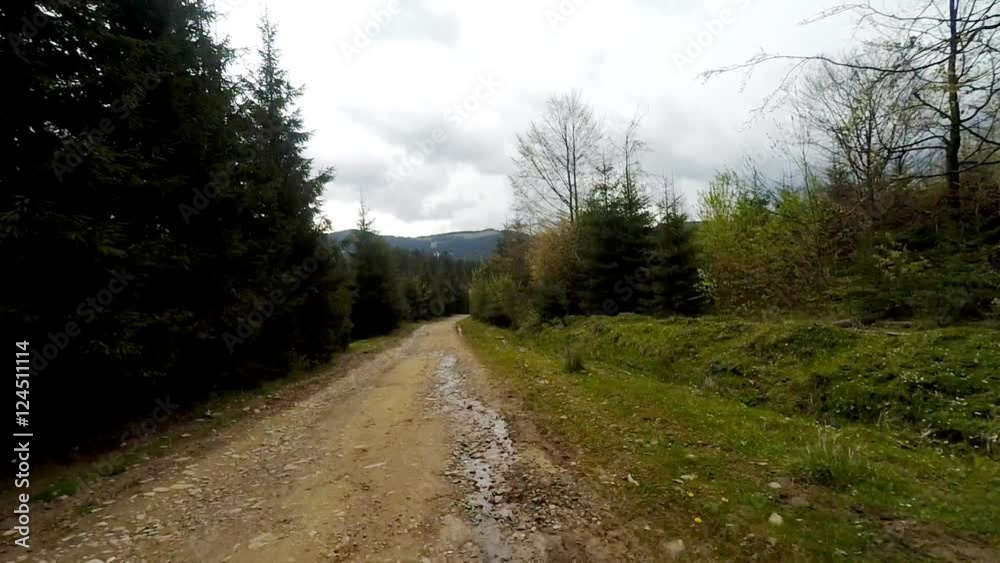 Car driving through the countryside in the mountains. The camera is outside. Car driving through the countryside in the mountains. The camera is outside.