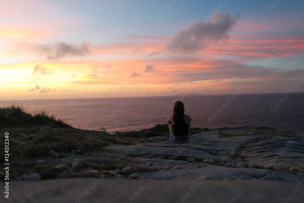 A girl watching a beautiful sunset