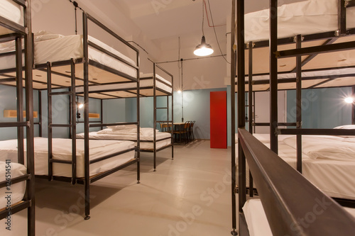 Students bedroom interior. Two levels beds in dormitory room