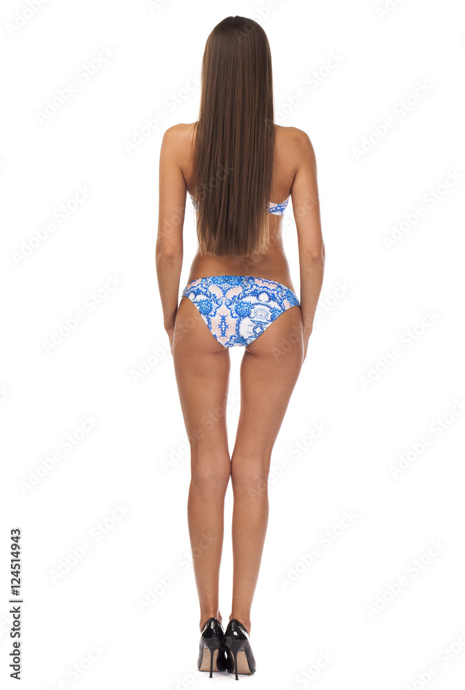 Full length portrait of young girl wearing blue bikini Full length portrait of young girl wearing blue bikini
