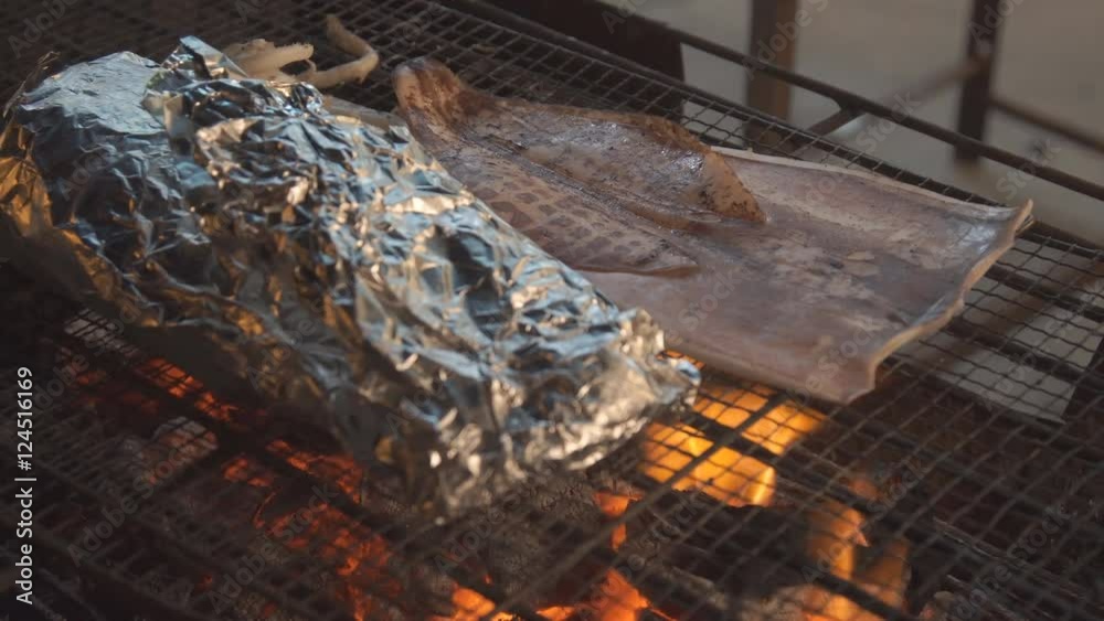 Video of flame grilled charcoal squid, night market street food. Video of flame grilled charcoal squid, night market street food.