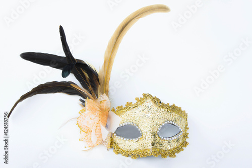 Fancy mask, accessories obscuring the face of the party.