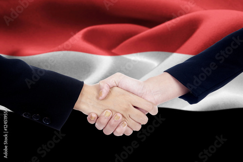 Business team in front of Yemen flag
