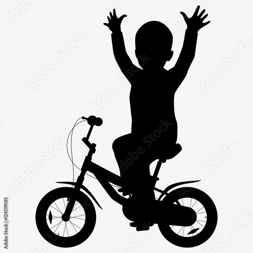 A boy rides a bicycle silhouette