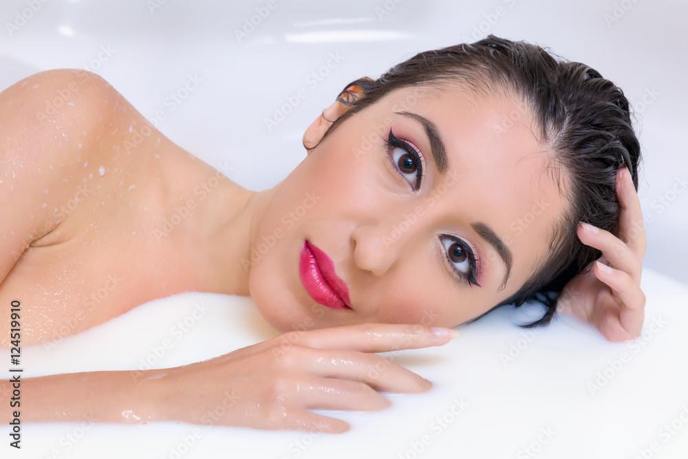 Perfect make-up woman in milk bath Perfect make-up woman in milk bath