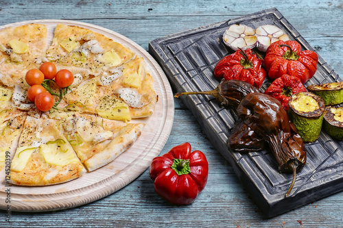 pizza and baked vegetables
